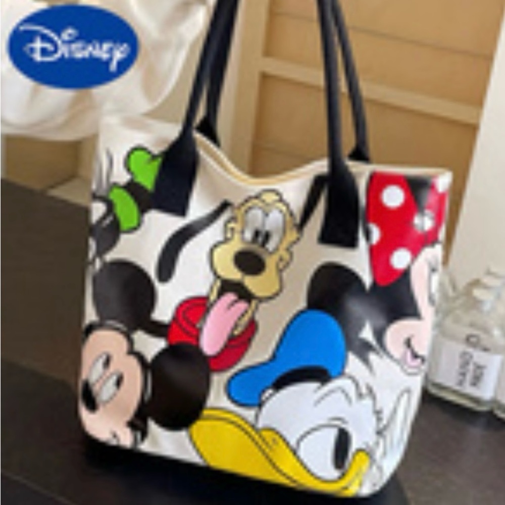 Disney medium handbag,w/black handles ,shows Mickey Mouse, Goofy and Donald Duck